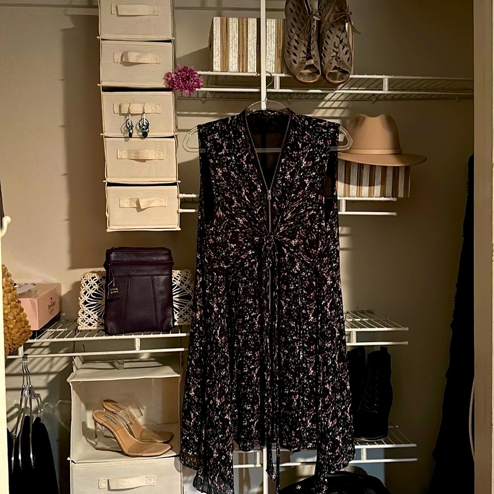 Upscale short sheer crape sleeveless dress.